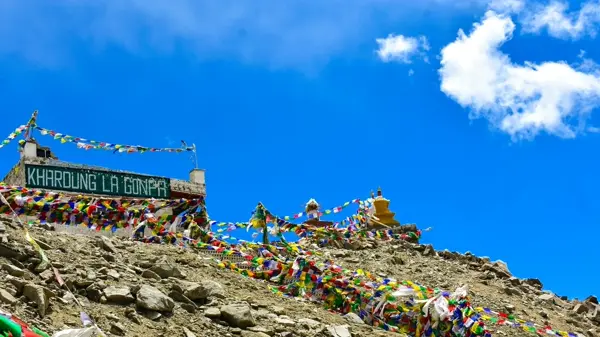Motorcyclists with gear on Leh Ladakh highway, ready for Himalayan bike trip